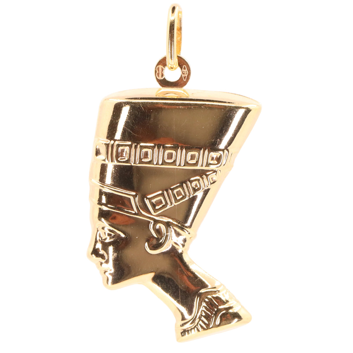 A gold pendant shaped like the profile of Queen Nefertiti, featuring detailed engravings on her headdress, shown against a plain white background.