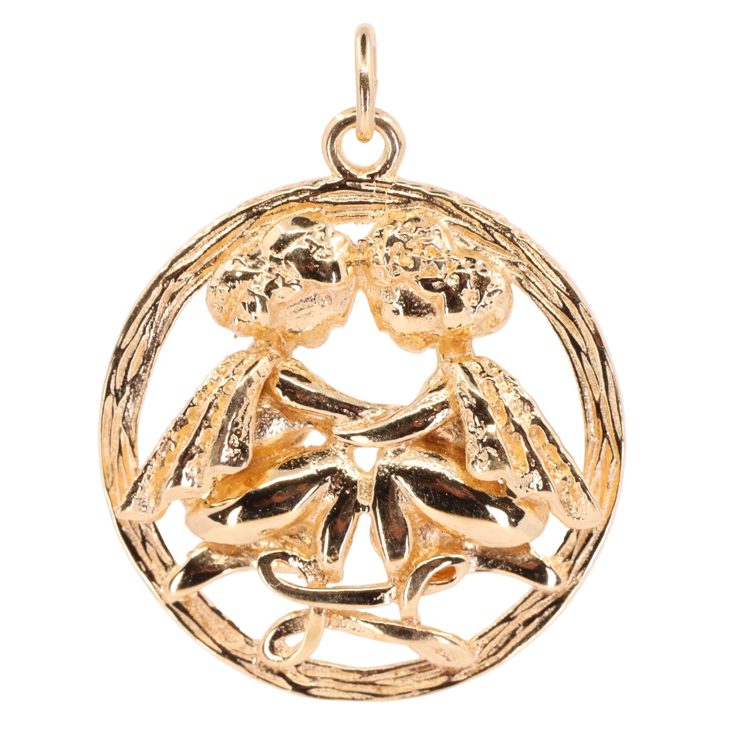 A gold pendant charm featuring a circular design with two stylized figures embracing, set against a plain light background.