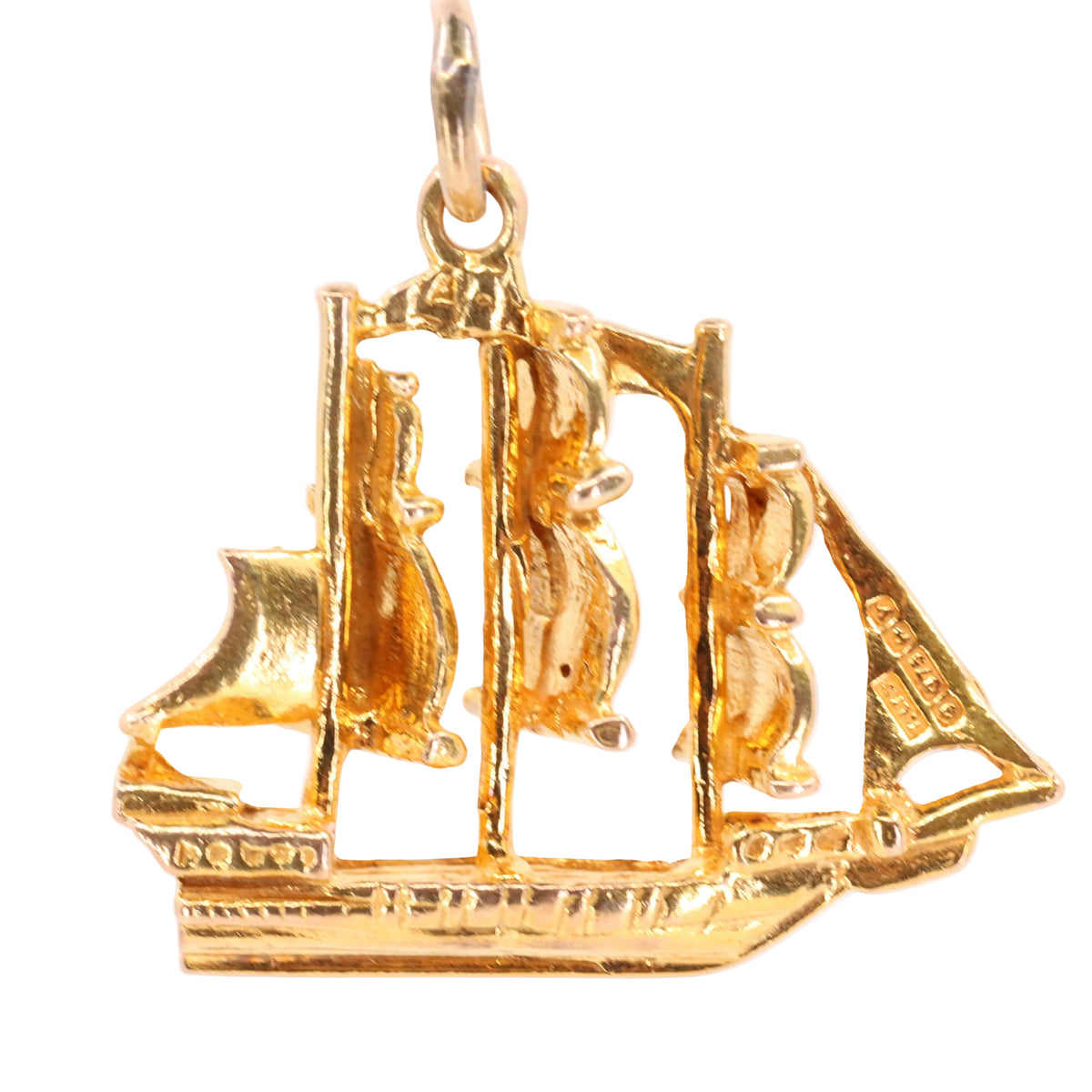 A gold ship pendant charm with three masts and a top hanging loop, shown against a plain white background.