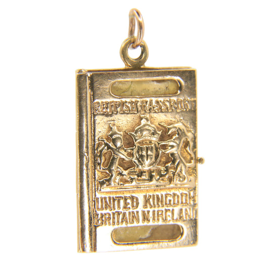 A small gold-toned British Empire passport booklet pendant charm, featuring embossed text and crest details, hanging against a plain white background.